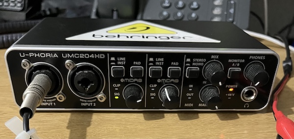 A Behringer UMC204HD USB audio interface.