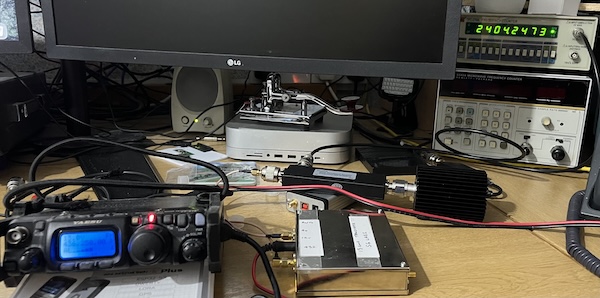 Photo of various pieces of equipment, specifically an FT818 transceiver, an SG Labs 13cm transverter and a frequency counter all connected together.