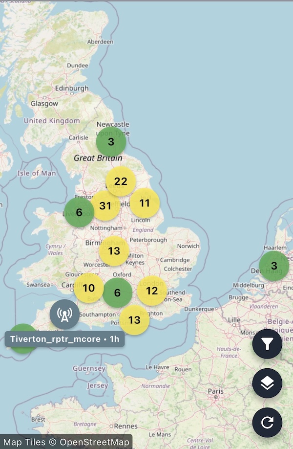 A screenshot of the iPhone Meshcore app showing the UK and part of Europe. It has a number of green and yellow circles showing the number of nodes in each area.