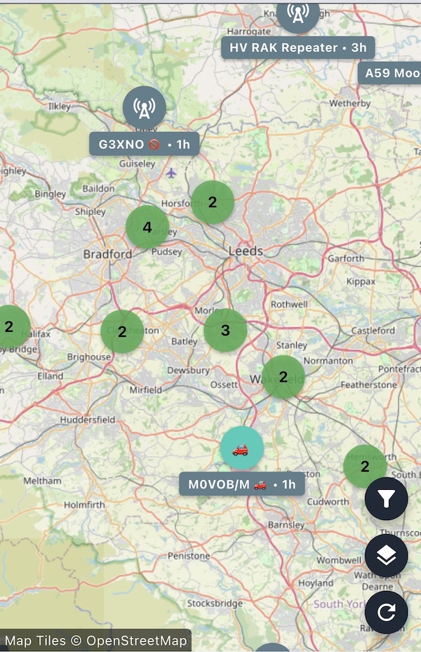 A screenshot of the iPhone Meshcore app showing the UK and part of Europe. It has a number of green and yellow circles showing the number of nodes in each area.