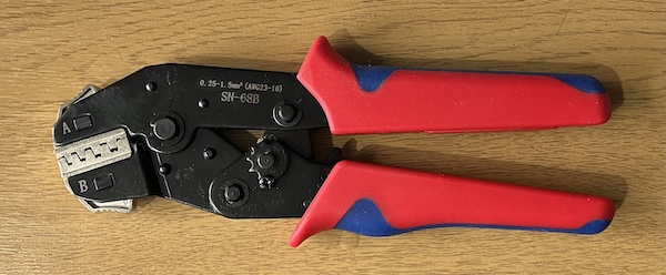 A ratchet crimping tool suitable for a variety of connectors including Molex pins.